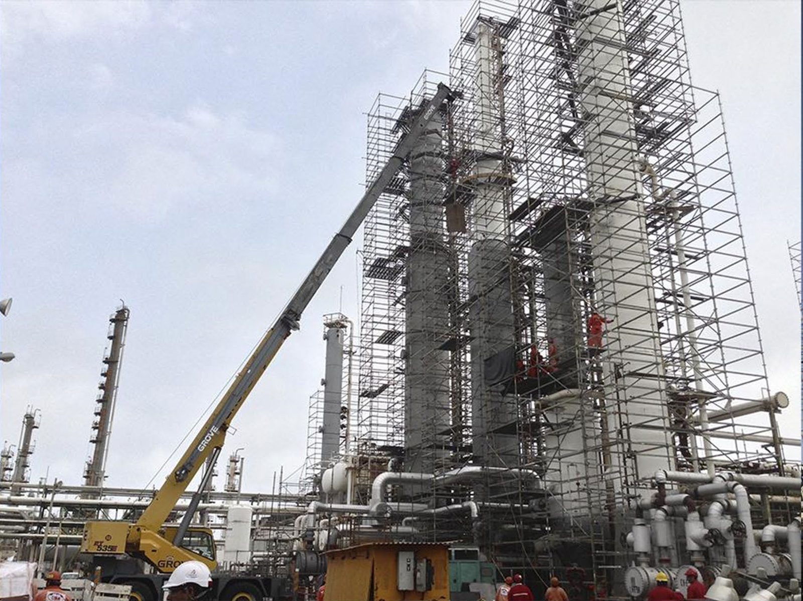 IES crews performing mechanical work at an industrial refinery.